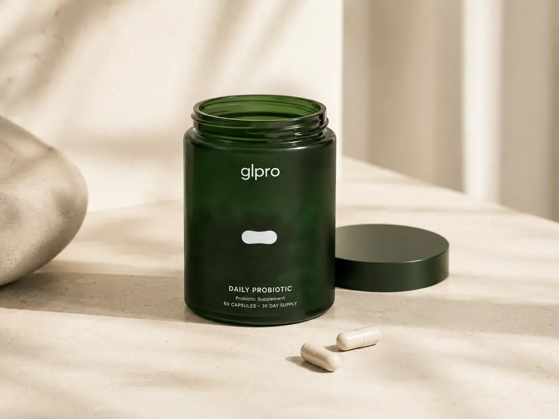 glpro Daily Probiotic jar with lid off and two capsules