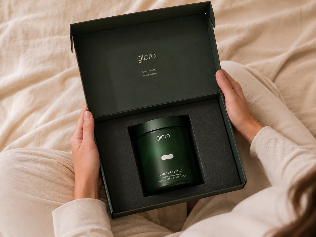 Hands holding an open glpro gift box with the jar inside
